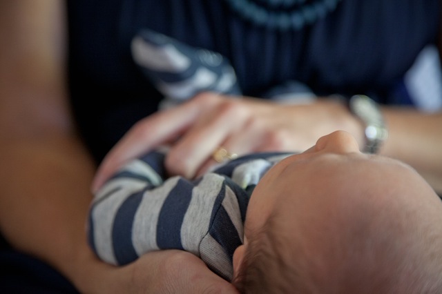 woman holding baby