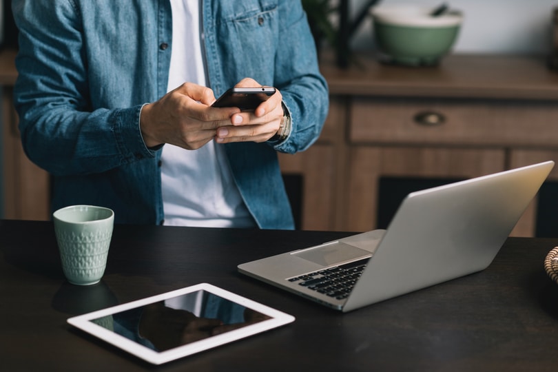 Man on his phone - Provide Everything In One Document: Folder