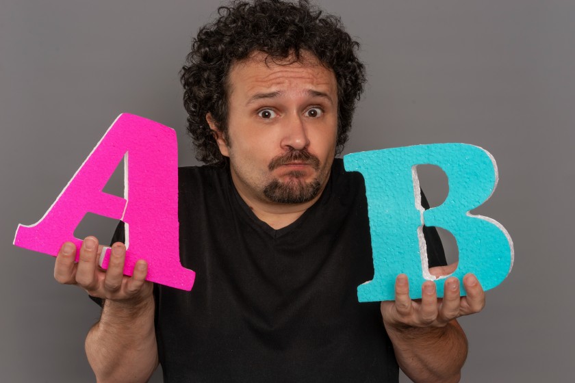 A:B Testing Man Male Holding Letters Wondering Split Experimentation