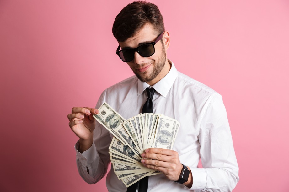 Confident Man Rich Hand Full of Dollar Bills Money Fortune Wealth