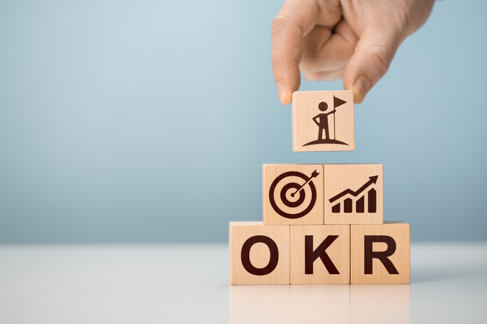 OKR Objectives and Key Results Goals Wooden Blocks Hand