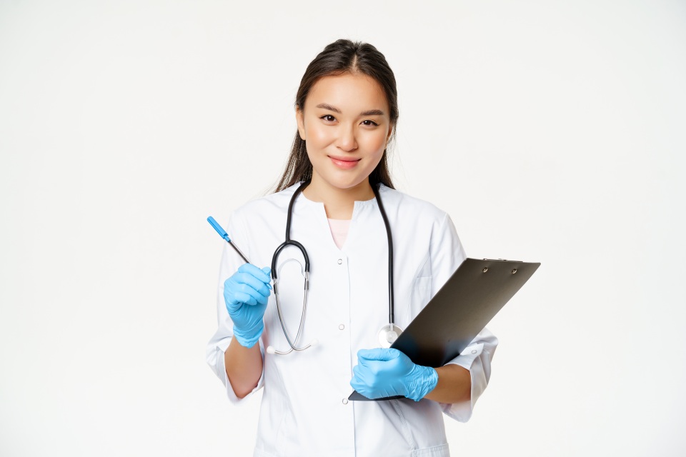 Smiling Asian Doctor Woman Female Nurse Pen