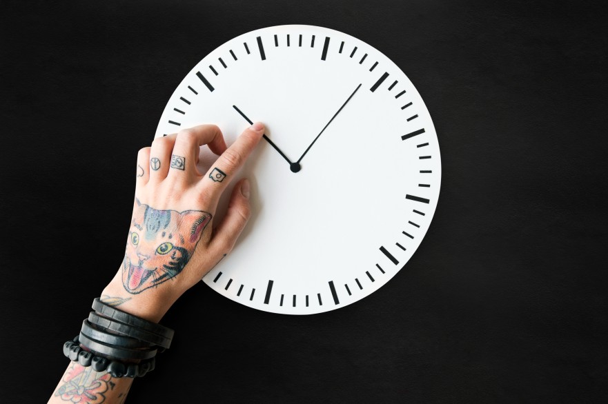 Tattooed Hand Pointing Time