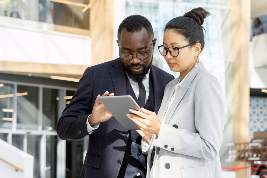 Data Driven Decisions Colleagues Checking Metrics Tablet Event Organization