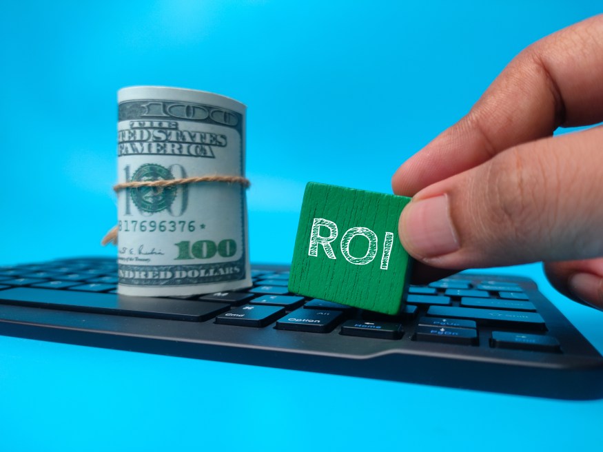 Generate Better ROI Return on Investment Dollar Bills Hand Business
