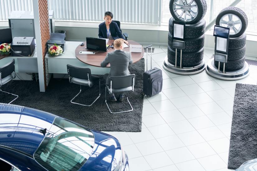 People at Car Dealer Buying Cars Automotive