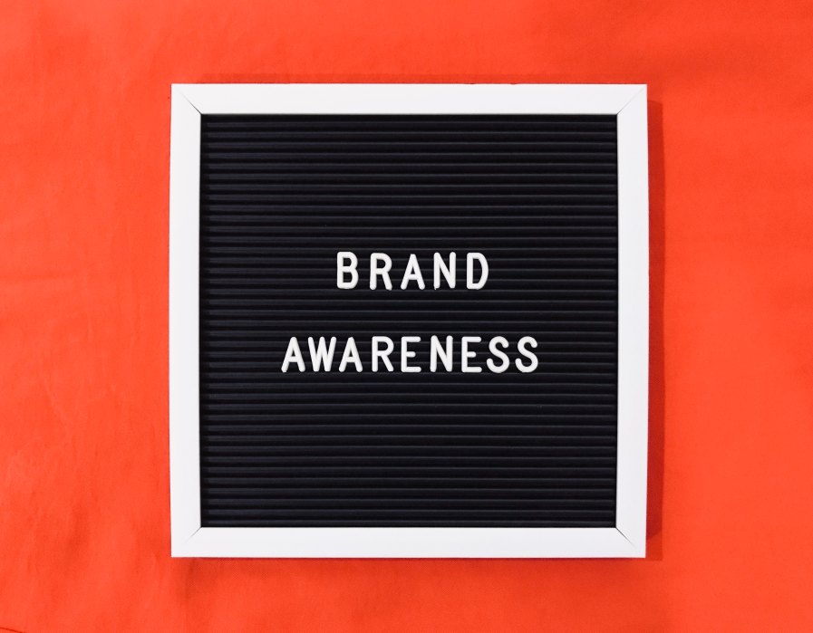 Brand Awareness Letters Blackboard Organge Red Background