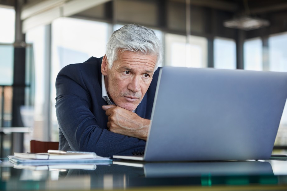 Businessman Sitting Laptop Desk Mature Complex Problem Resolution Pensive