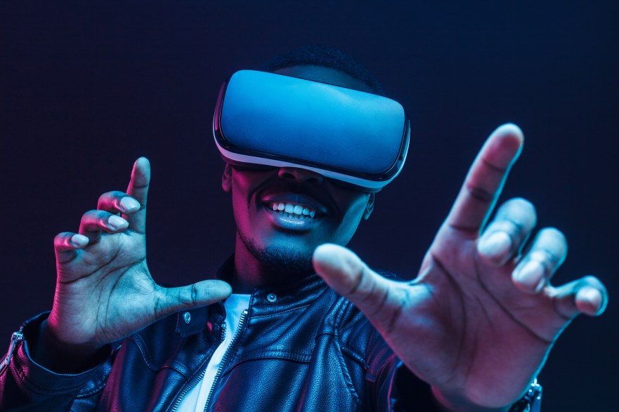 Man Wearing VR Goggles Virtual Reality Glasses Male Having Fun Enjoying Time Happy