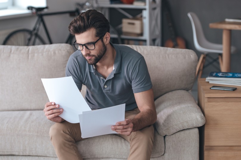 Timely Invoicing Man Male Sofa Looking Bills Invoices