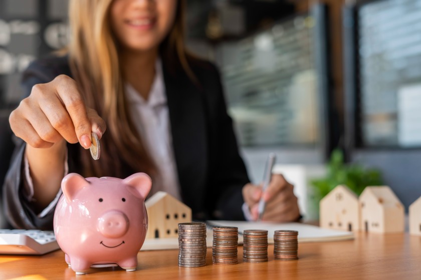 Businesswoman Putting Coins Piggy Bank Cost Savings Save Money Business