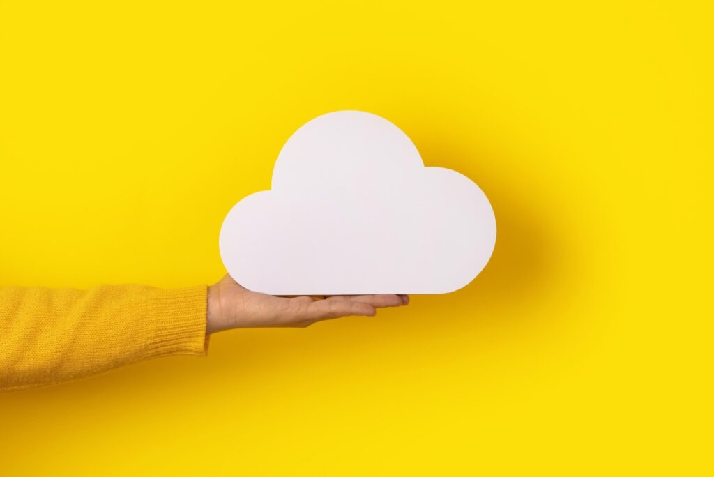 Cloud Based Tools Computing Software Concept Yello Hand Holding Clouds