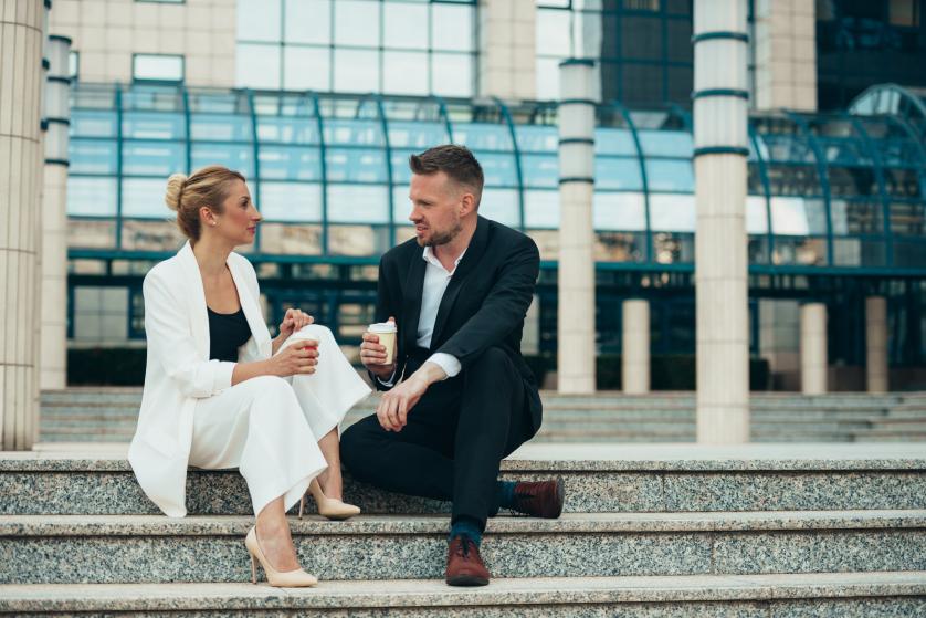 Nurture Business Relationship Man Woman Sitting Down Stairs Discussing Conversation