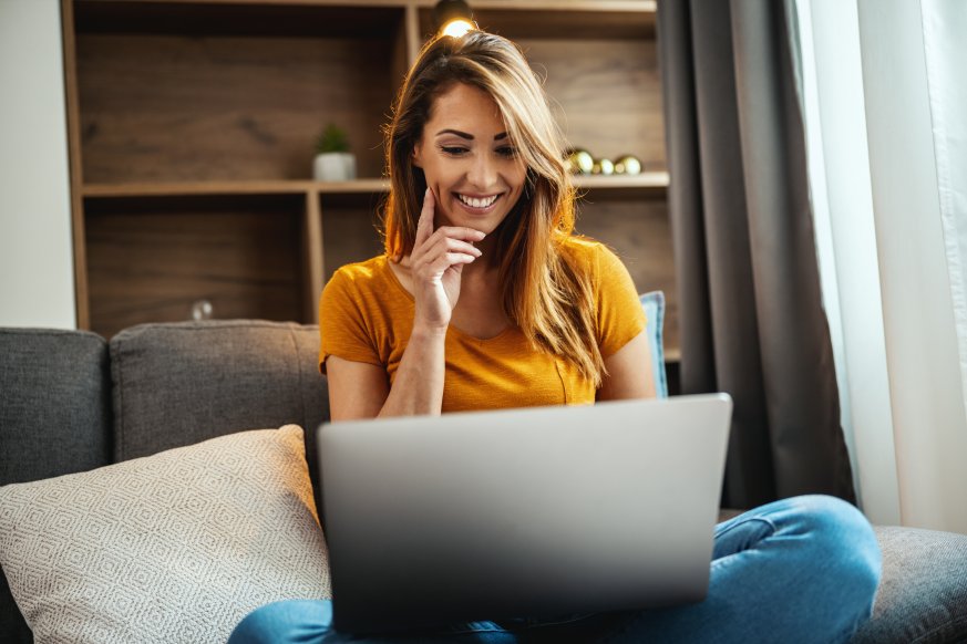 Woman Female Updating Optimizing Website Content Sofa Happy Smiling