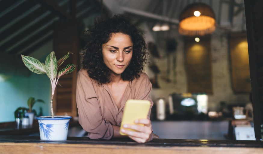 Woman Using Smartphone Promoting Event Social Media Female Home Plant