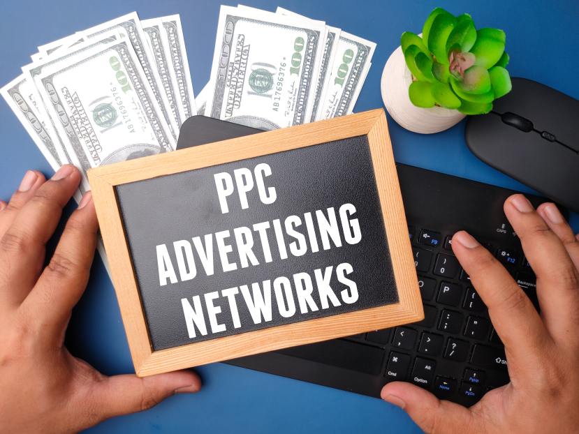PPC Advertising Networks Chalkboard Money Dollar Bills Keyboard Hands