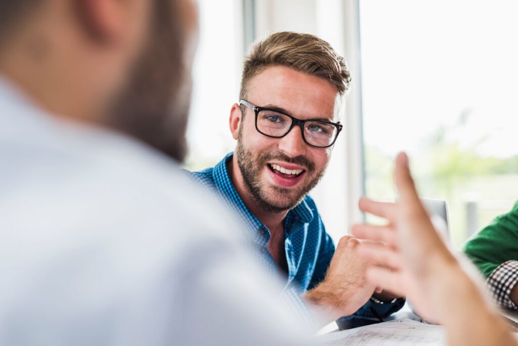 Confident young professional in a meeting representing his branding agency