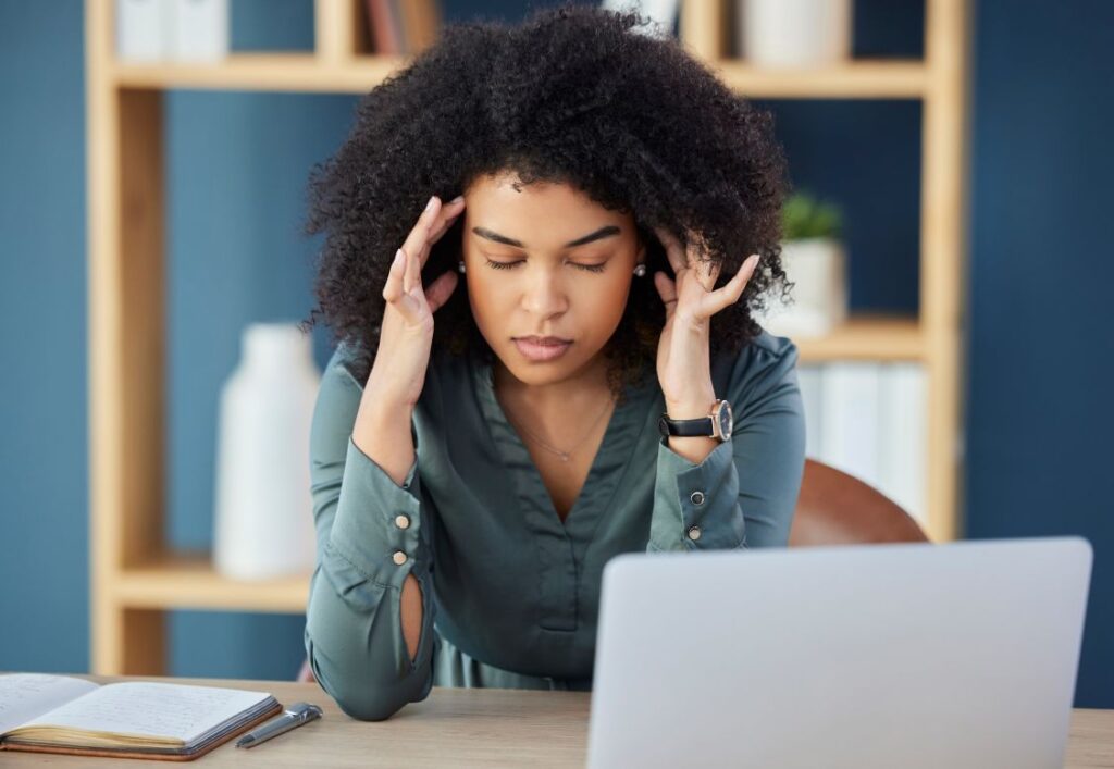 Woman having headache because of SEO compliance requirements