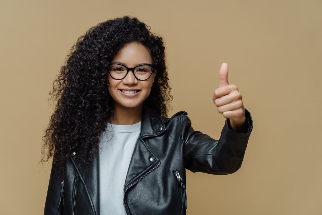 Woman shows thumb up for selecting the best SEO agency