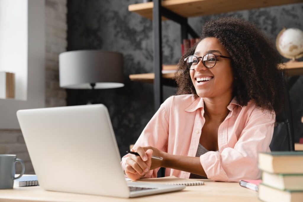 A professional attending a webinar using her laptop