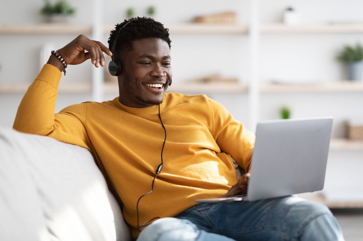 A professional web designer talking to his client over the phone