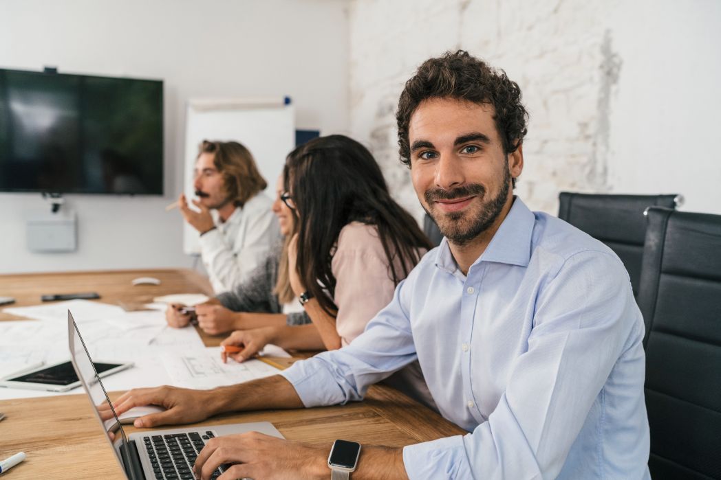 Young team of coworkers in a digital marketing agency making a decision