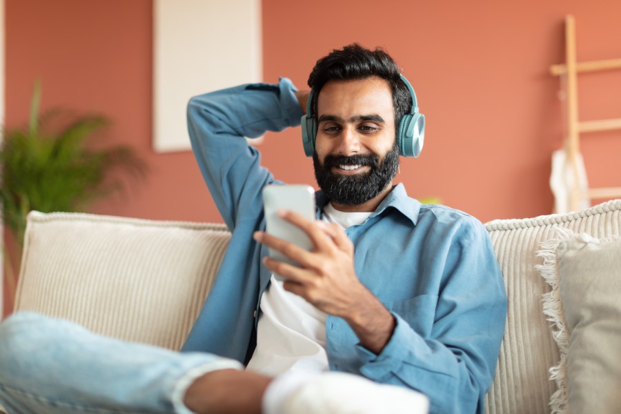 Man Smartphone Headphones Sofa Happy Listening Music