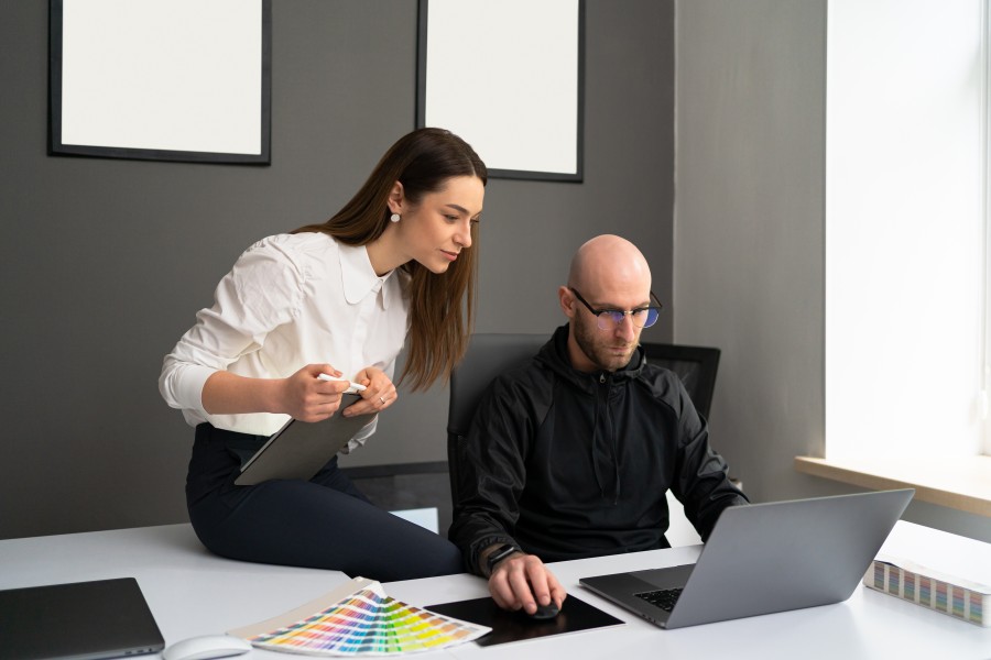 2 Professional Businesspeople Colleagues Discussing Latop Office Design User Behavior Man Woman Formal