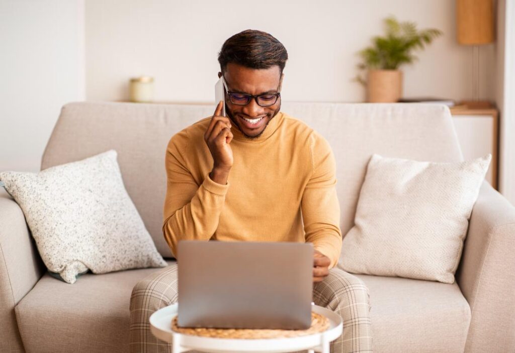 Man using laptop to prepare for a remote selling presentation