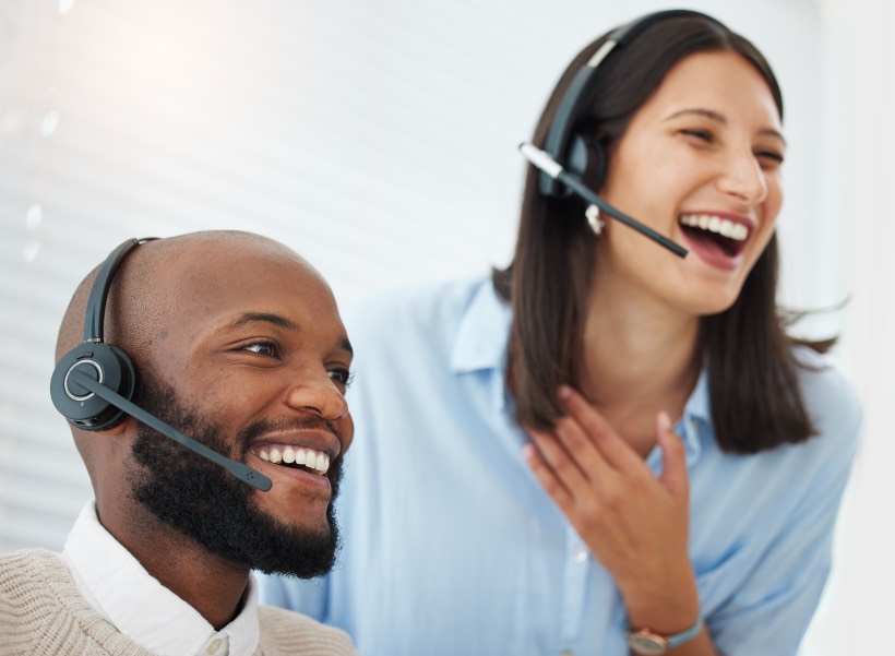 Customer Service Excellence Woman Man Happy Team Co-Workers Headphones