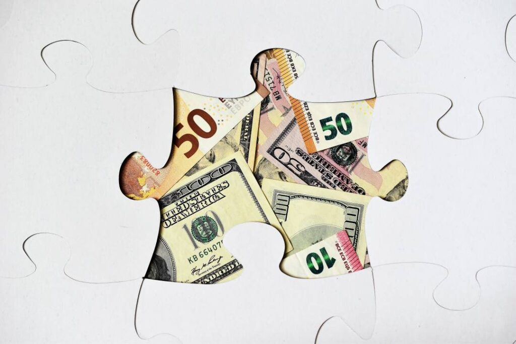 Money and puzzle pieces