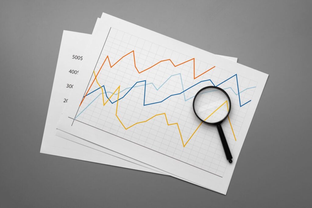 Business graph analysis documents on gray background