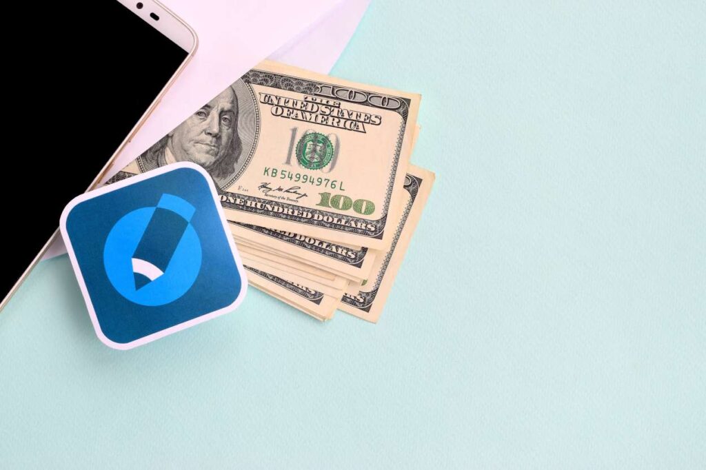 Aa phone, a drawing of a pen, and cash in dollars