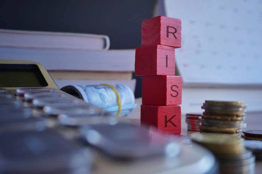 Mitigate Financial Risks Concept Red Wooden Blocks Money Coins Bills