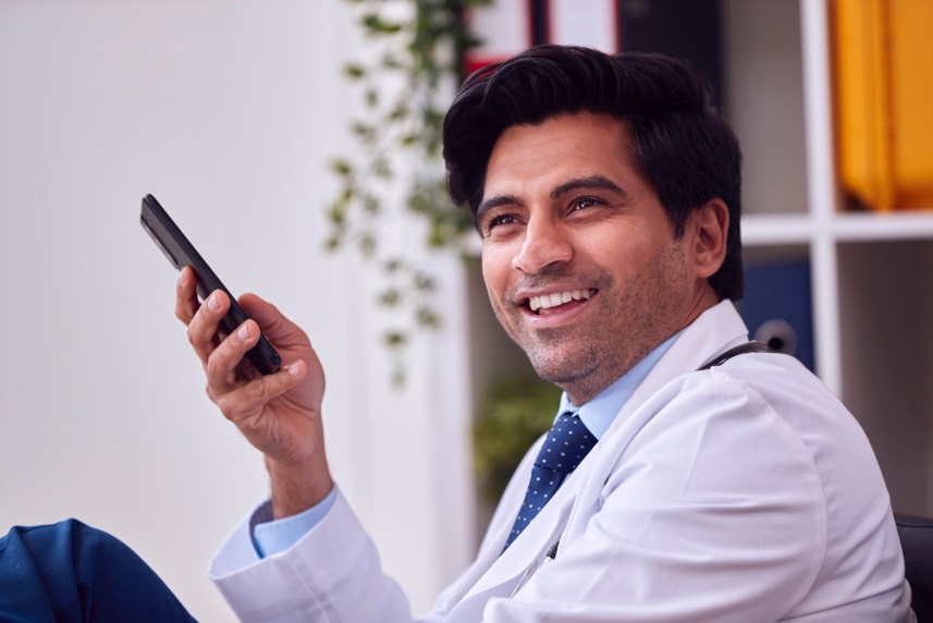 Smiling Male Doctor Using Phone Mobile Smartphone