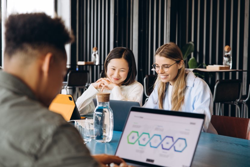 Coworkers Team Members Collaborating Digital Tools Laptops SaaS