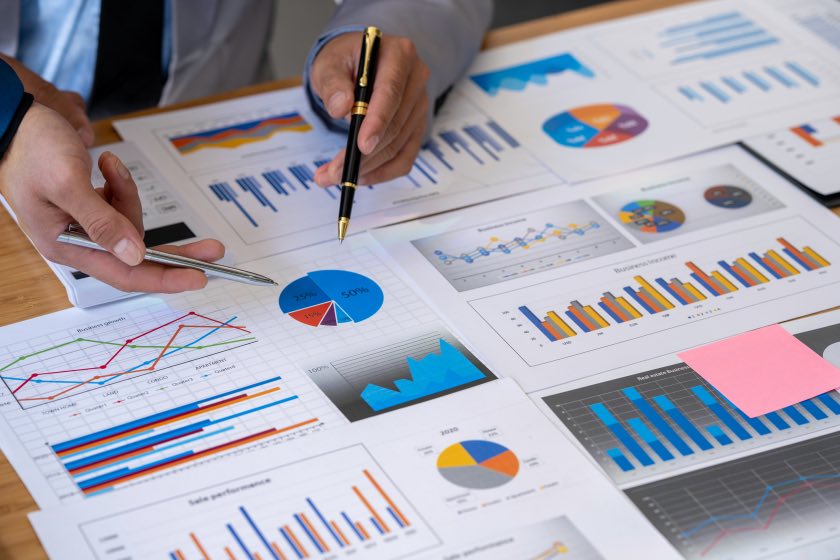 Analyzing Data Pens Charts Paper Sheets Graphs People Hands Analytics